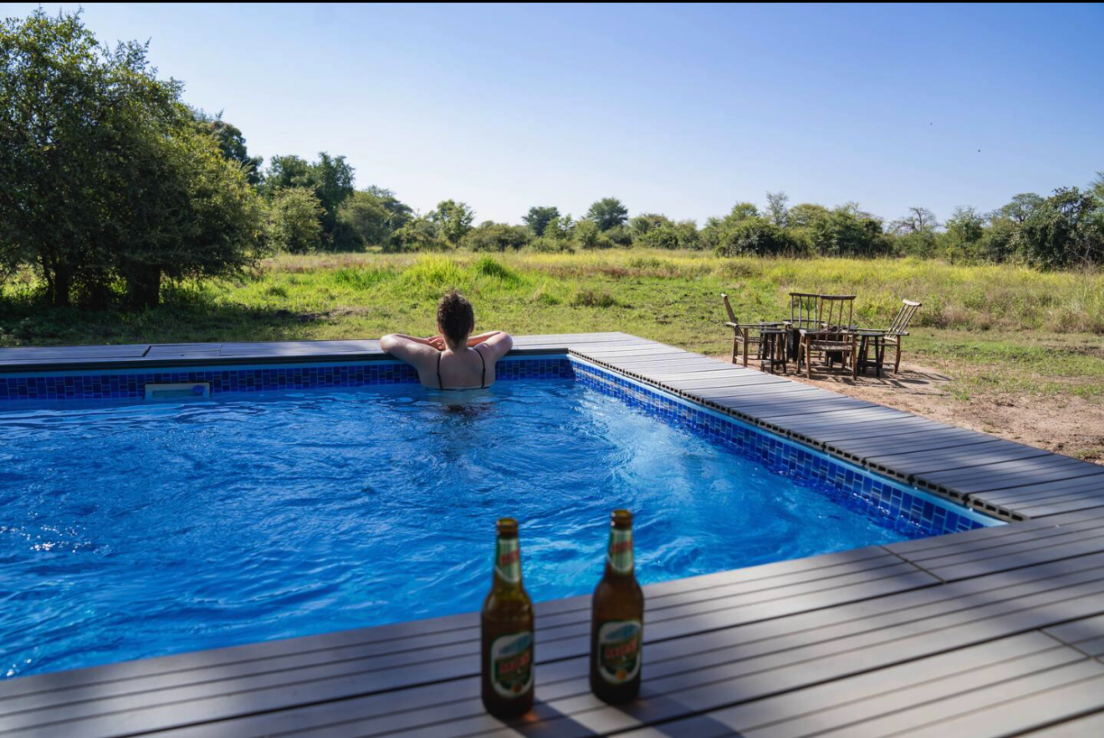 Cooling off in the pool with a Mosi beer and bush views