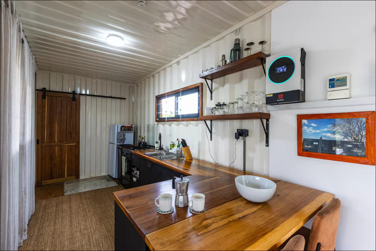 Bright kitchen interior with timber counters and shelves
