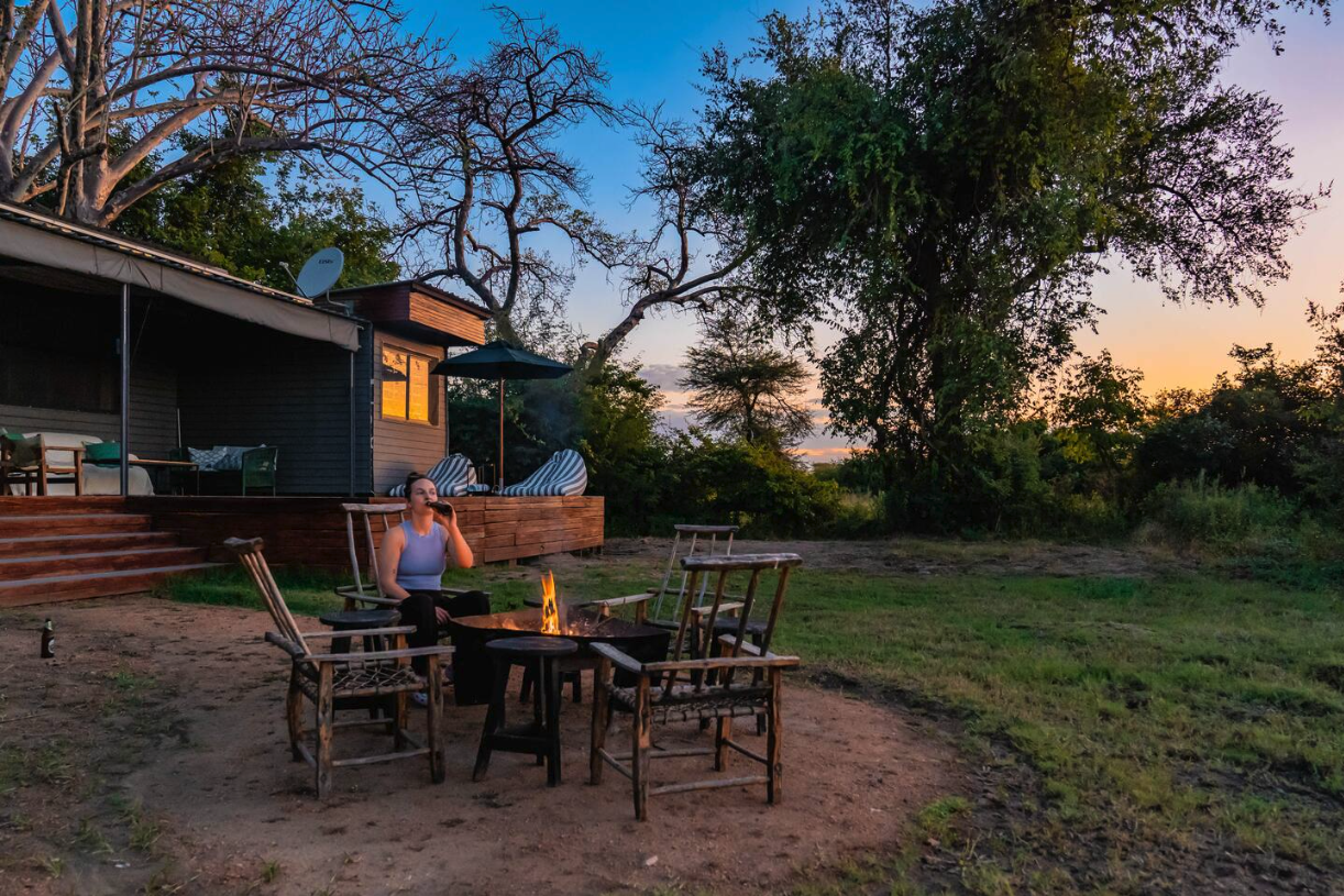 Campfire seating beside The Bush Box at blue hour