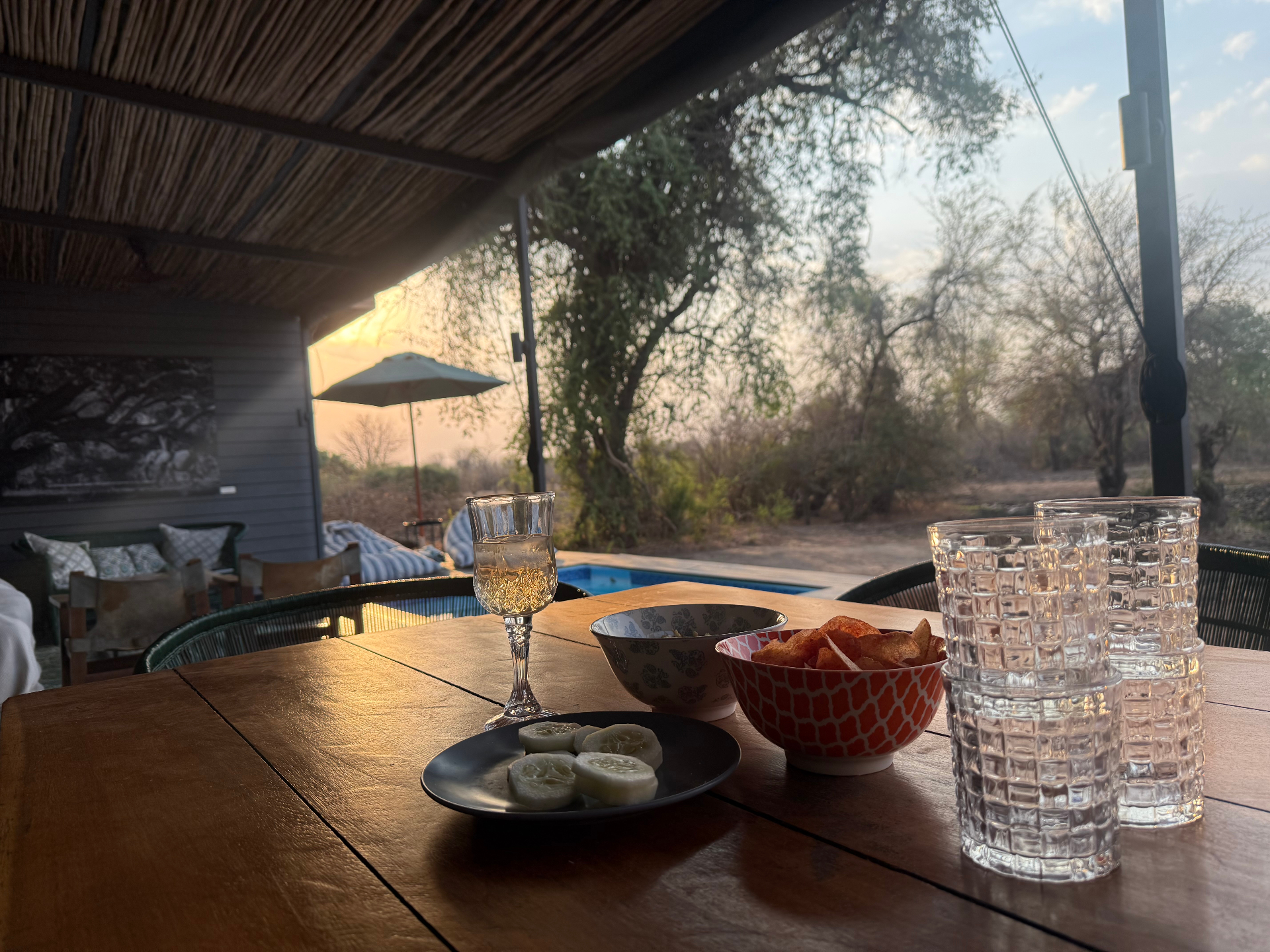 Sundowner drinks and snacks on the deck overlooking the pool
