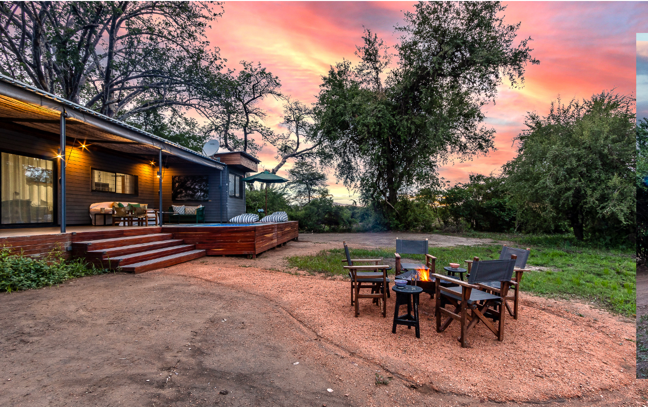 The Bush Box and firepit under a pink sunset sky